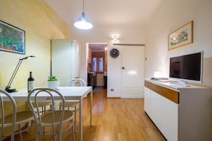 Comfort Apartment | Living area | 32-inch flat-screen TV with digital channels, TV