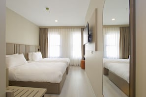 Ropa de cama de alta calidad, cubrecamas y minibar