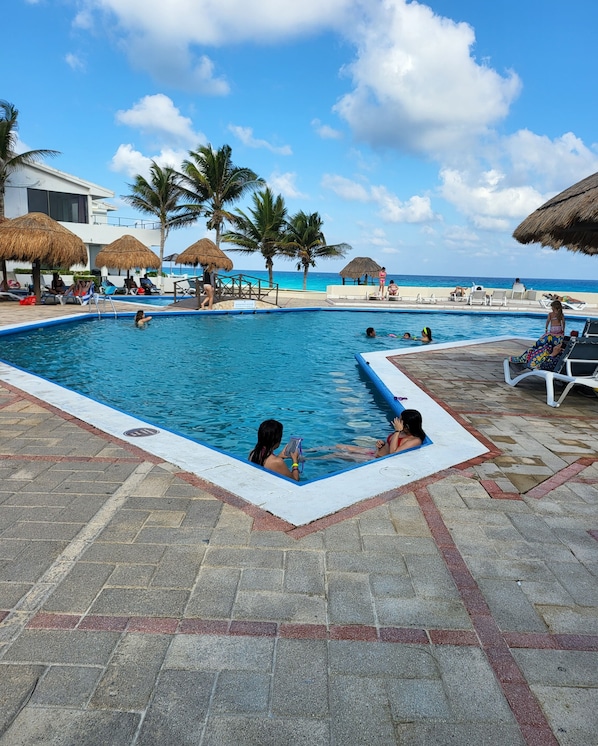 Outdoor pool, pool umbrellas, sun loungers