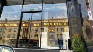 The exterior of the Abis Palace Hotel with a prominent 'HOTEL' sign above the entrance. - Reikartz Abis Tashkent (Tashkent)
