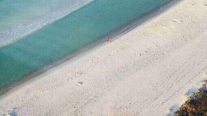 A beach with clear water and a sandy shore. - The Lazy Place: Gulf Penthouse, High Ceiling &Bunk (Panama City Beach)