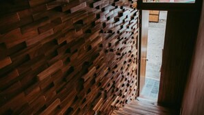 A wooden wall with a unique geometric pattern.
