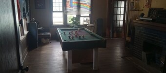 Classic family sized home with game room and recording studio ping pong exercise