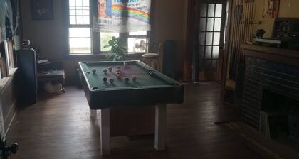 Classic family sized home with game room and recording studio ping pong exercise