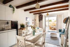 Enjoy a spacious living area with a kitchen, dining space, and cozy seating area.