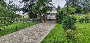 Stroll through the beautifully landscaped grounds to the entrance of this modern building.