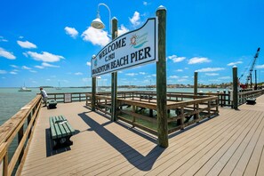 Enjoy the ocean views and stroll along the pier, which features benches and a welcoming sign.