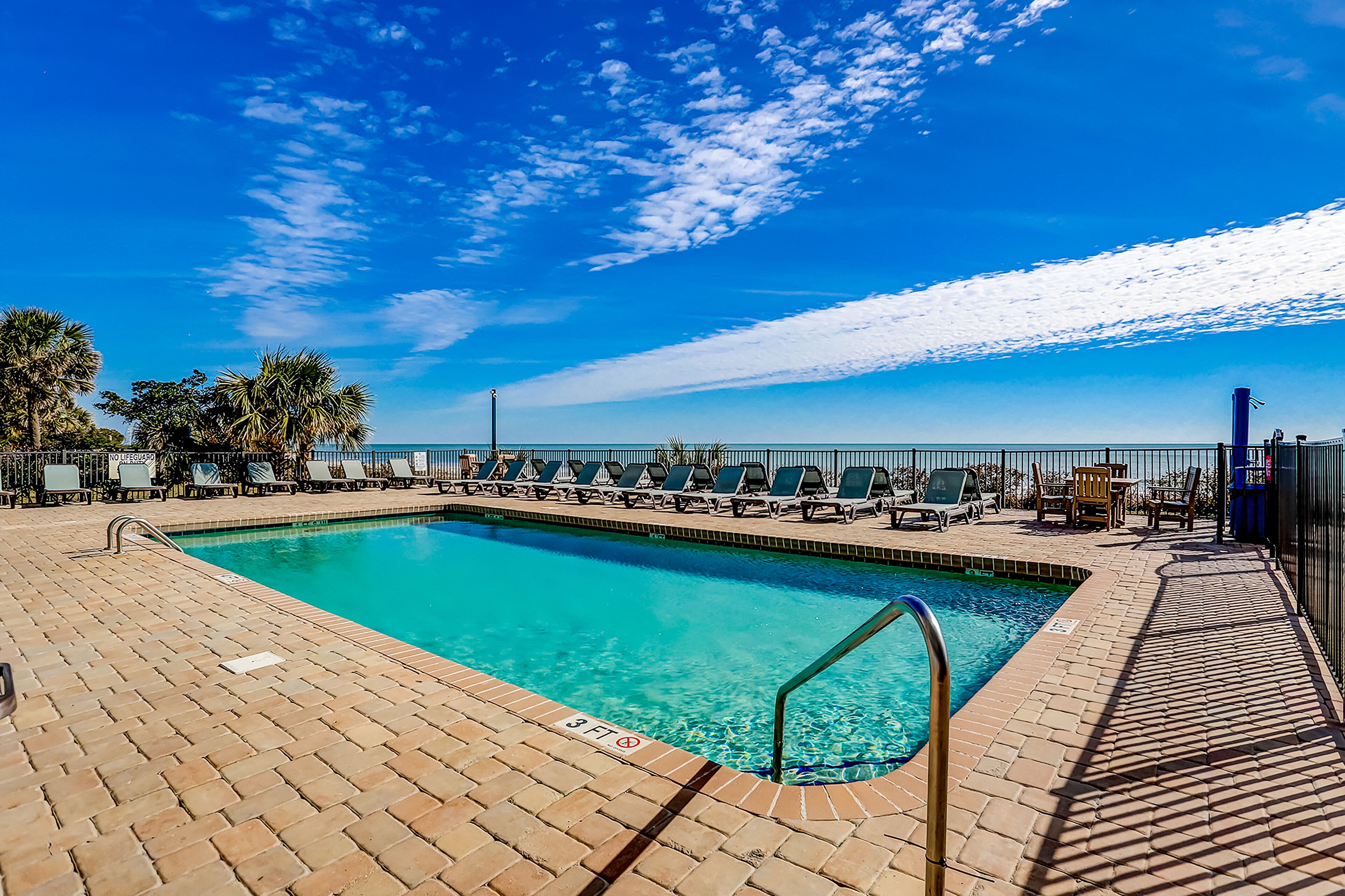 Beachfront resort condo with ocean view, pools, hot tub, lazy river, & arcade