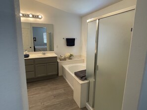 Jetted tub, hair dryer, towels, toilet paper