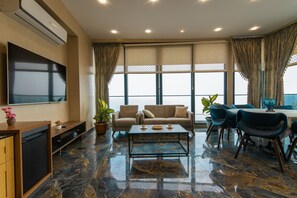 Luxury Suite, 1 Double Bed, Non Smoking, Sea View | Living area | 100-cm TV with satellite channels