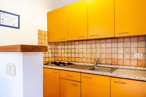 Fridge, stovetop, highchair, cookware/dishes/utensils