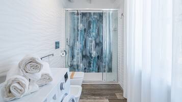 Bathtub, hair dryer, towels