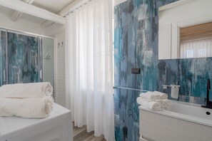 Bathtub, hair dryer, towels