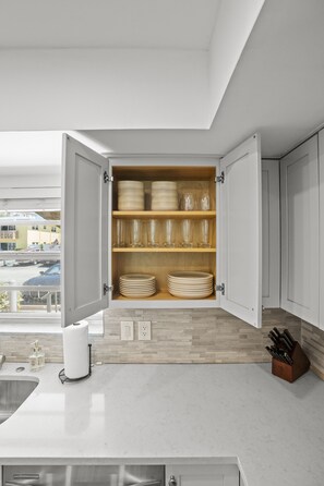 Our kitchen is fully stocked and ready for your culinary adventures! 🍽️ Find all the dinnerware you need for delicious meals and memorable gatherings. ✨ - HOT TUB! 1 Block to the BEACH! King Beds! BBQ! (West Palm Beach)