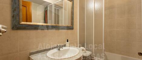 Bathtub, hair dryer, towels