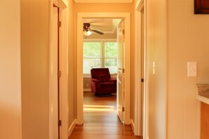 Enter a cozy room with a large window and a comfortable armchair.