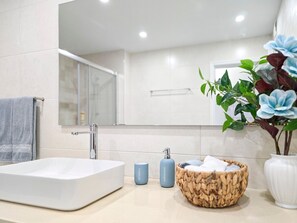 Bathtub, hair dryer, towels