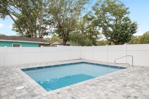 Take a refreshing dip in your private pool, surrounded by elegant paver stones and complete privacy fencing for ultimate relaxation. - Walk to Beach - 4BR Surfside Beach Home w/ Private Pool & Beach Access (Surfside Beach)