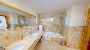 Bathtub, hair dryer, towels