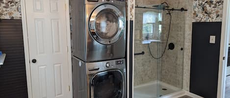 Shower, hair dryer, towels, soap