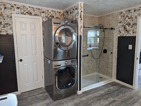 Shower, hair dryer, towels, soap. Little Blue Farmhouse