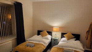 Classic Twin Room | Blackout drapes, iron/ironing board, WiFi (free), bed sheets