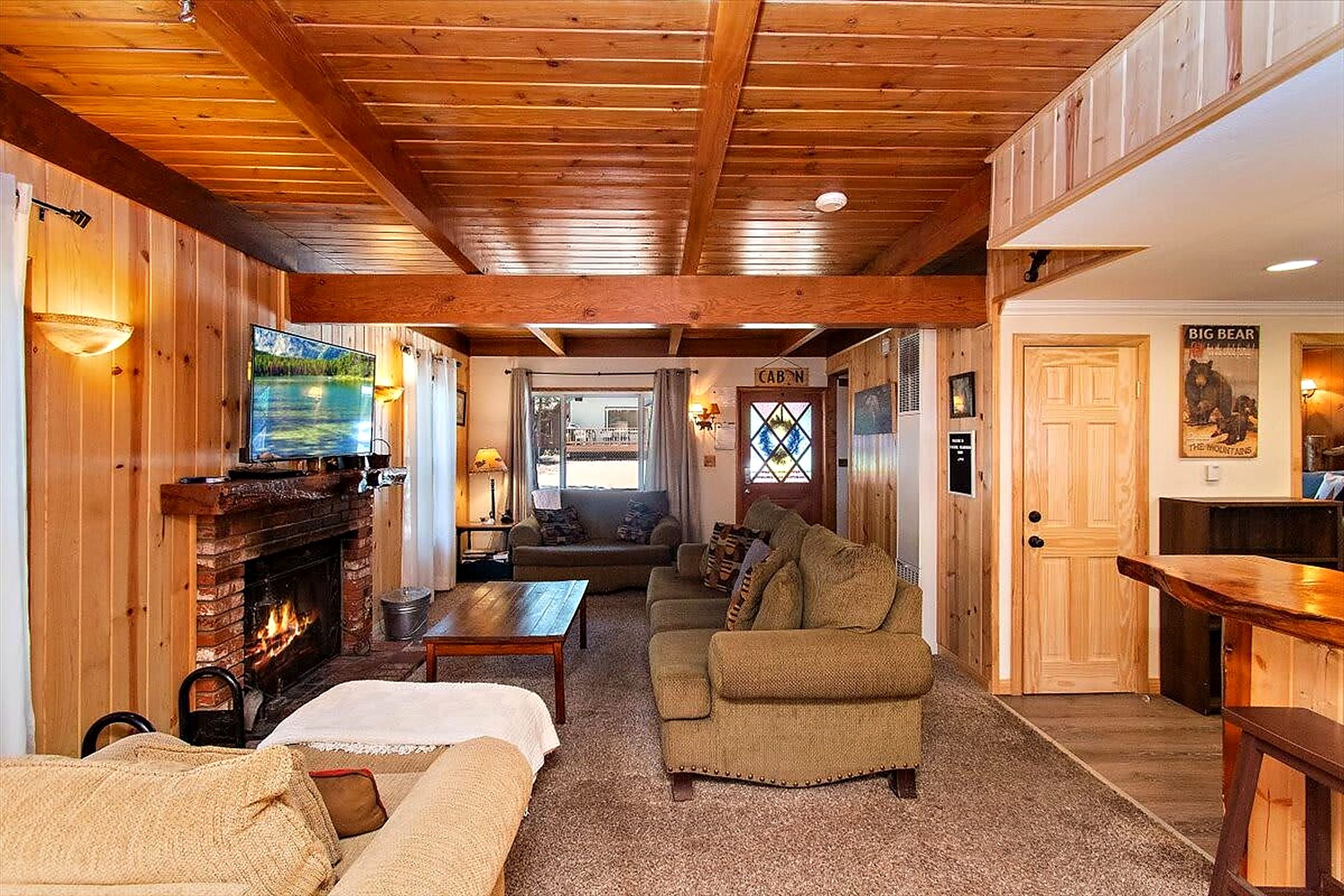 Living room with wood-burning fireplace and smart TV