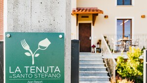 A sign for La Tenuta Di Santo Stefano Agri Resort.