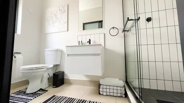 Shower, towels, soap, toilet paper - Cozy | Sleek & Stylish | High Tech Smart Home (Sandton)