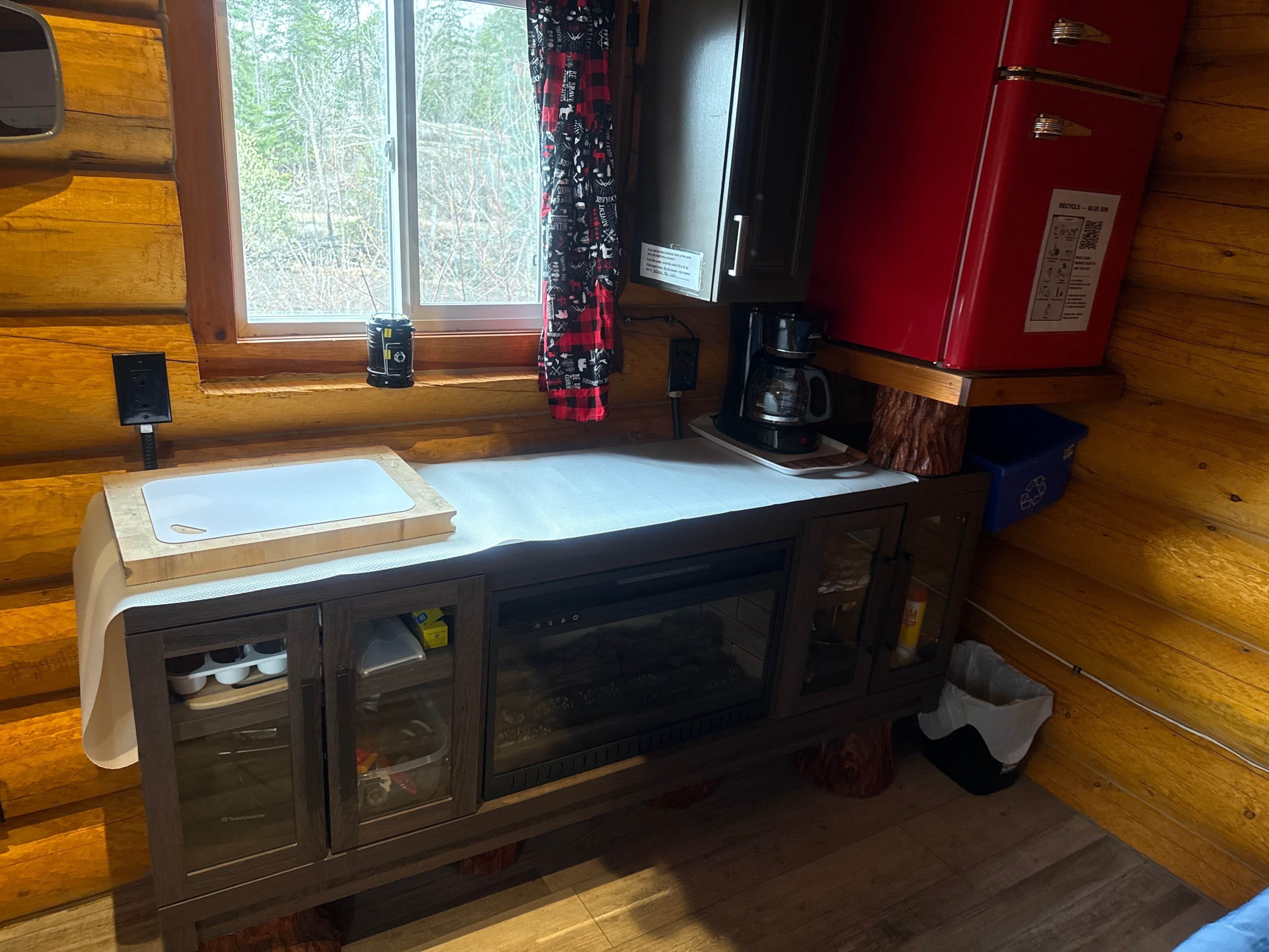 Fridge, coffee/tea maker, toaster, cookware/dishes/utensils