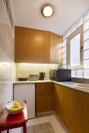 Fridge, microwave, electric kettle, cookware/dishes/utensils