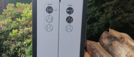 A control panel with 'start' and 'stop' buttons, and a brand name 'hager'.