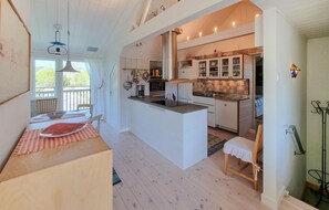 Fridge, stovetop, dishwasher, coffee/tea maker