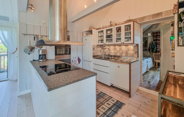 Fridge, stovetop, dishwasher, coffee/tea maker
