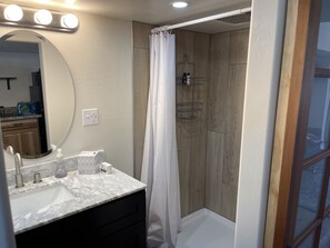 Shower, hair dryer, towels, soap