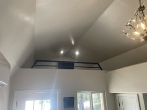 Enjoy the airy feel of this spacious room with a high ceiling and natural light pouring in through the skylight.