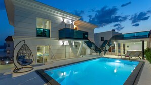 A modern house with a swimming pool, a hanging chair, and a hot tub. - Lovely home in Crikvenica (Crikvenica)