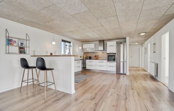 Fridge, stovetop, dishwasher, coffee/tea maker