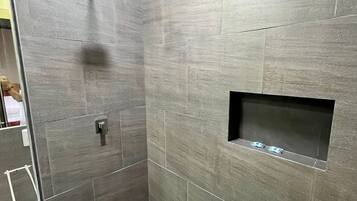 Rainfall showerhead, towels, soap, toilet paper