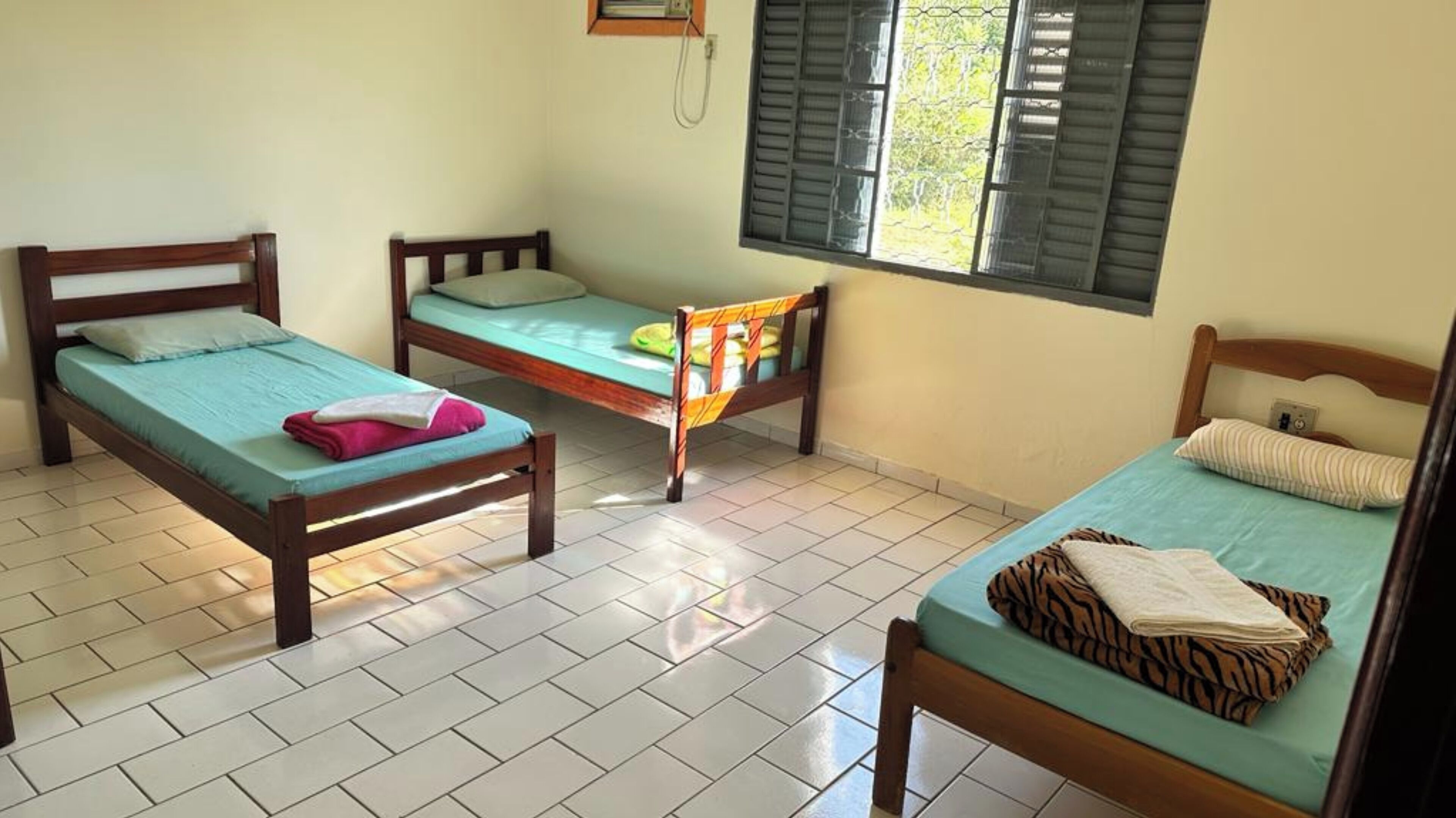 Basic Quadruple Room | Soundproofing, free WiFi, bed sheets