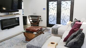 Smart TV, fireplace, books, printers