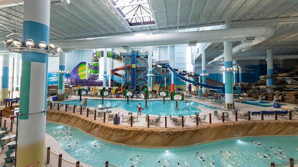 An indoor water park with multiple slides and pools. - Cozy&Tranquil Heaven With KingSuite&Covered Patio&BigFencedYard, 5-Star-Location (Austin)
