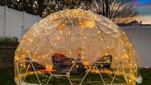 A geodesic dome structure with string lights inside, set on a grassy lawn. - Estate 5BR 3.5Bath with IGLOO, Game Rm, Fire Pit sleeps 16- 5min Princeton dwtn (Princeton)