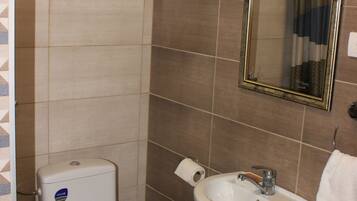 Shower, hair dryer, slippers, towels