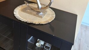A bathroom vanity with a mirror, a sink, and a cabinet with drawers.