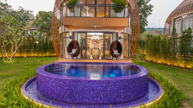A modern two-story house with a circular swimming pool in front. - Bird Nest Villas by Mafiya (Koh Rong)
