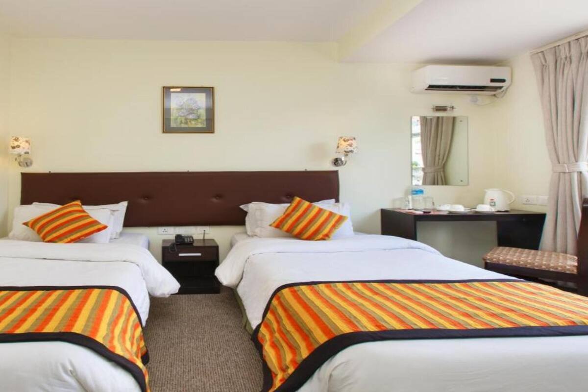 Habitación Deluxe con 2 camas individuales | 1 habitación, wifi gratis y ropa de cama