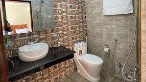 A bathroom with two sinks, a toilet, and a shower. - Paradise View Hotel And Restaurant (Khaira Gali)
