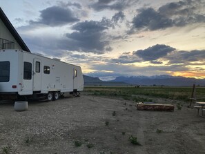Park your home away from home in this cozy RV, complete with a sliding door and multiple windows.