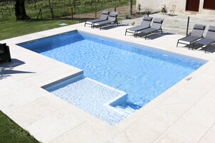 Outdoor pool, pool umbrellas, sun loungers